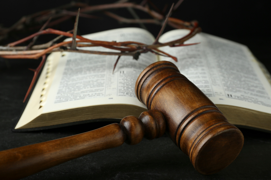 Judge Gavel, Bible and Crown of Thorns on Black Table, Closeup